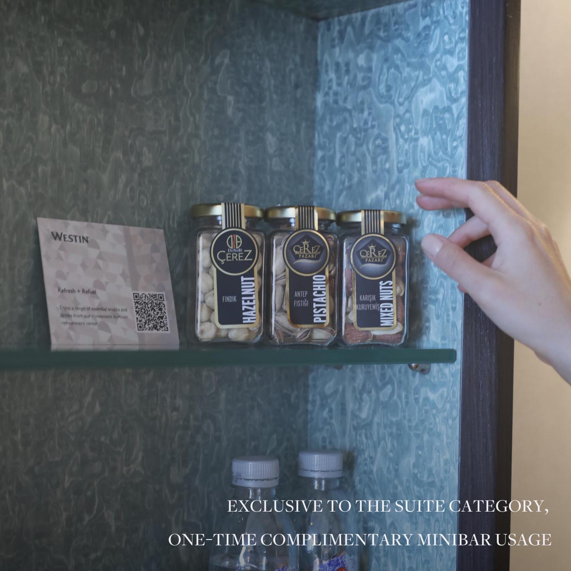 The Westin Istanbul Nisantasi Hotel Ngoại thất bức ảnh A hand selecting a spice from a spice rack